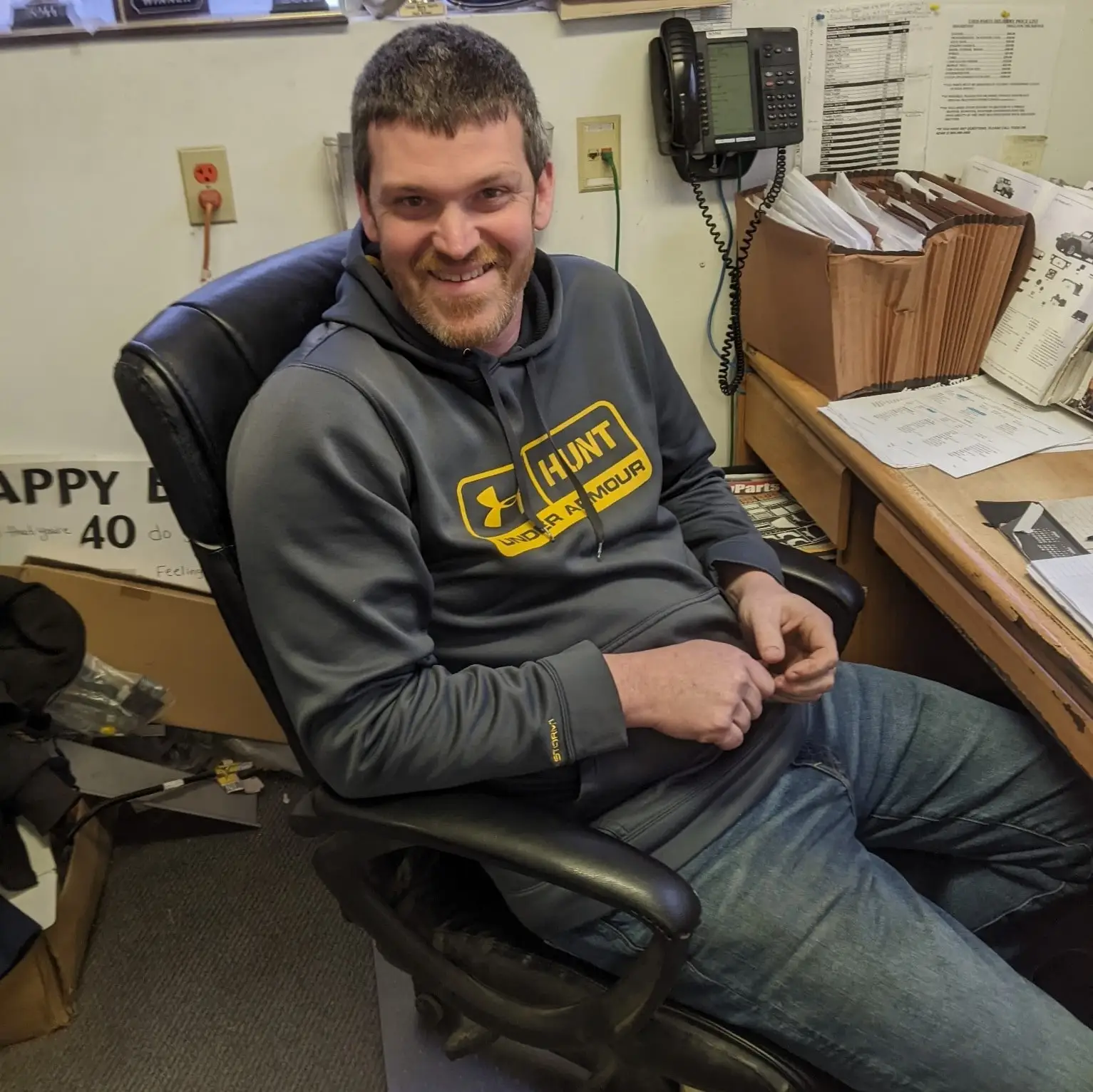 Adam sitting at desk