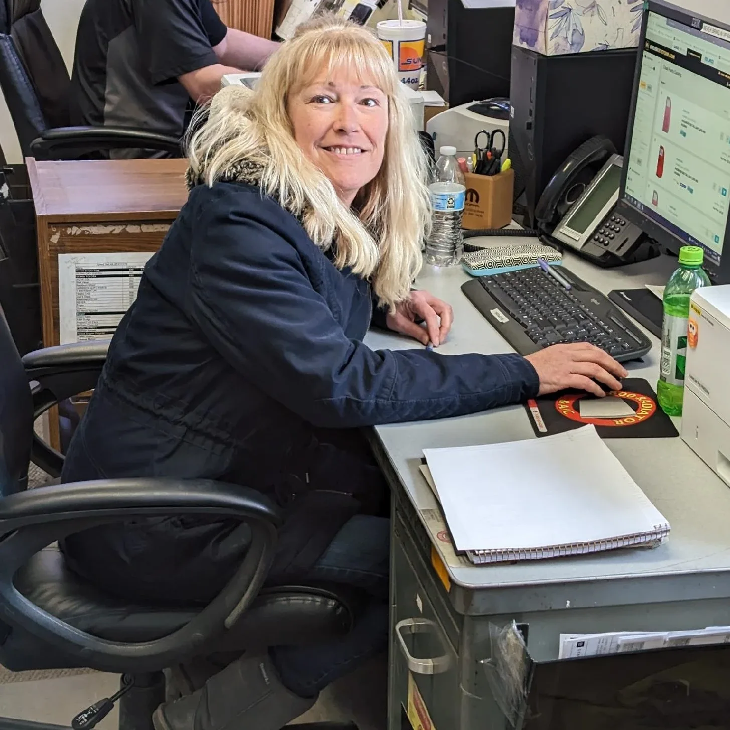 Kim sitting at desk